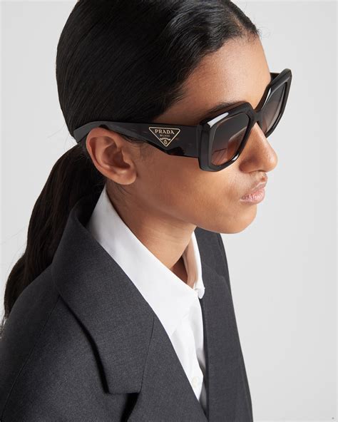 Sunglasses with Prada logo .